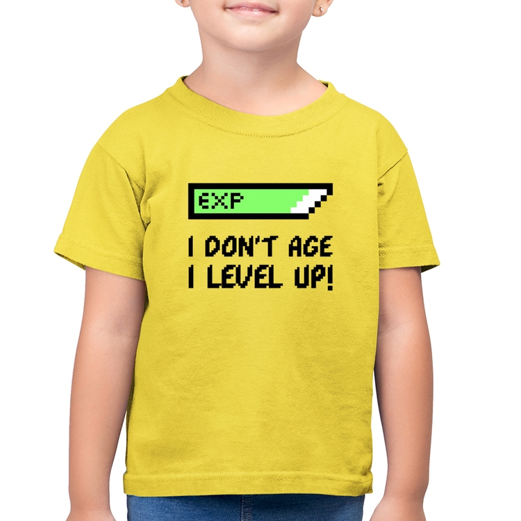 Camiseta Algodão Infantil I Don't Age, I Level Up - Amarelo Canário
